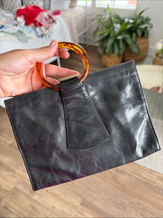 HOBO Handbags - HOBO Black Leather Wristlet with Amber Tortoiseshell Ring Handle